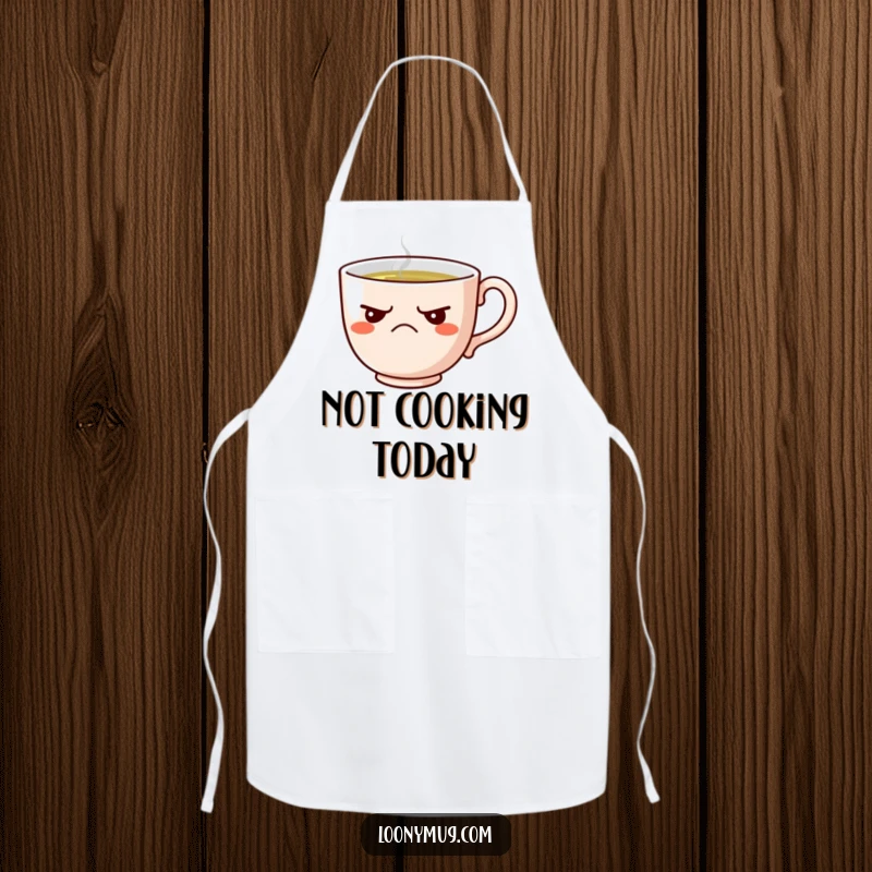 Funny apron showing a grumpy teacup refusing tea, perfect for kitchen protection with attitude.