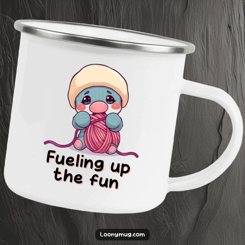 Funny camping mug featuring a mischievous sock puppet character intently trying to consume a large, fluffy ball of yarn.