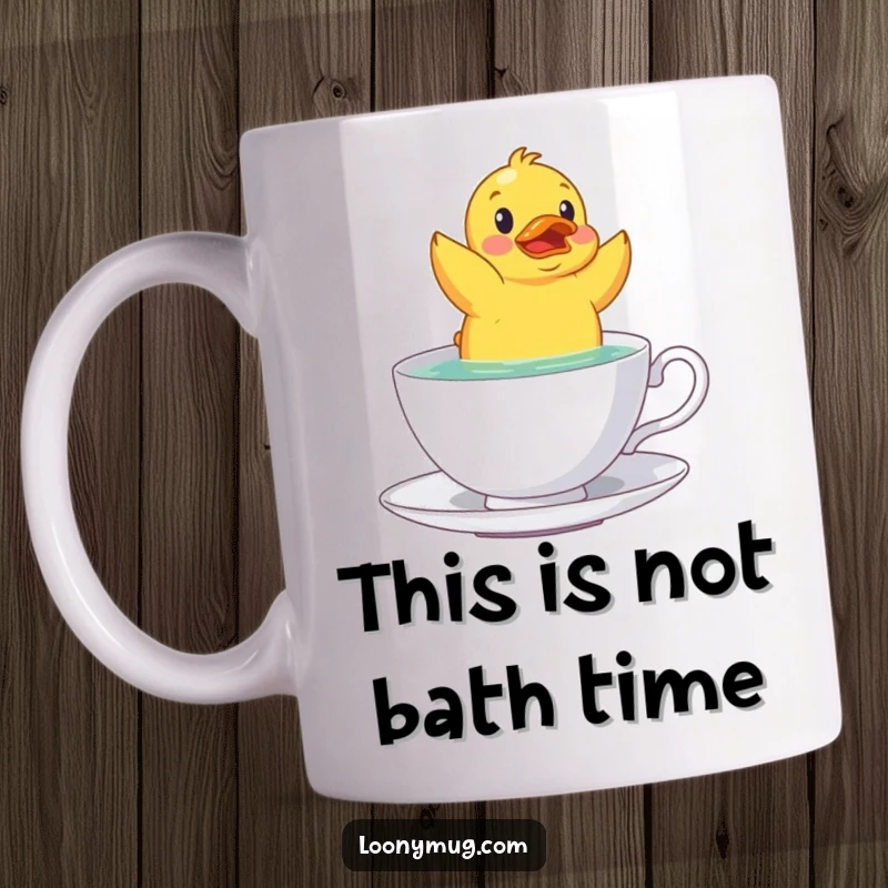 Funny startled rubber duck floating upside down in a teacup, depicted humorously on this delightful mug.