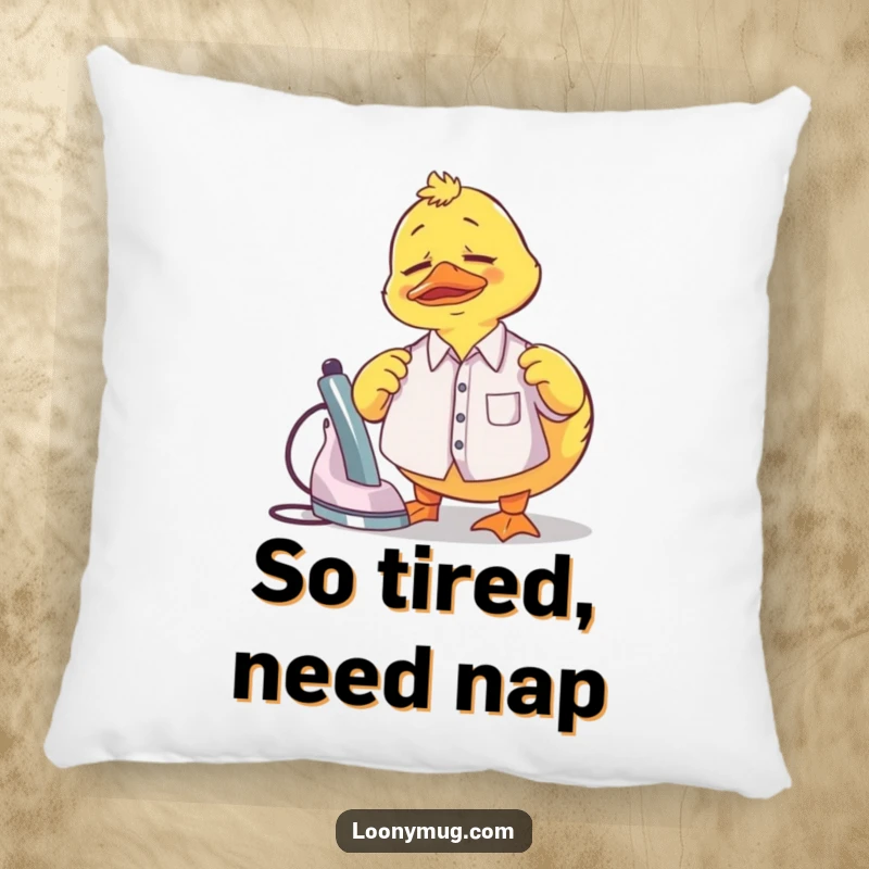 Funny Pillow showcasing a confused rubber duck attempting to iron a tiny shirt, bringing comfort and humor.
