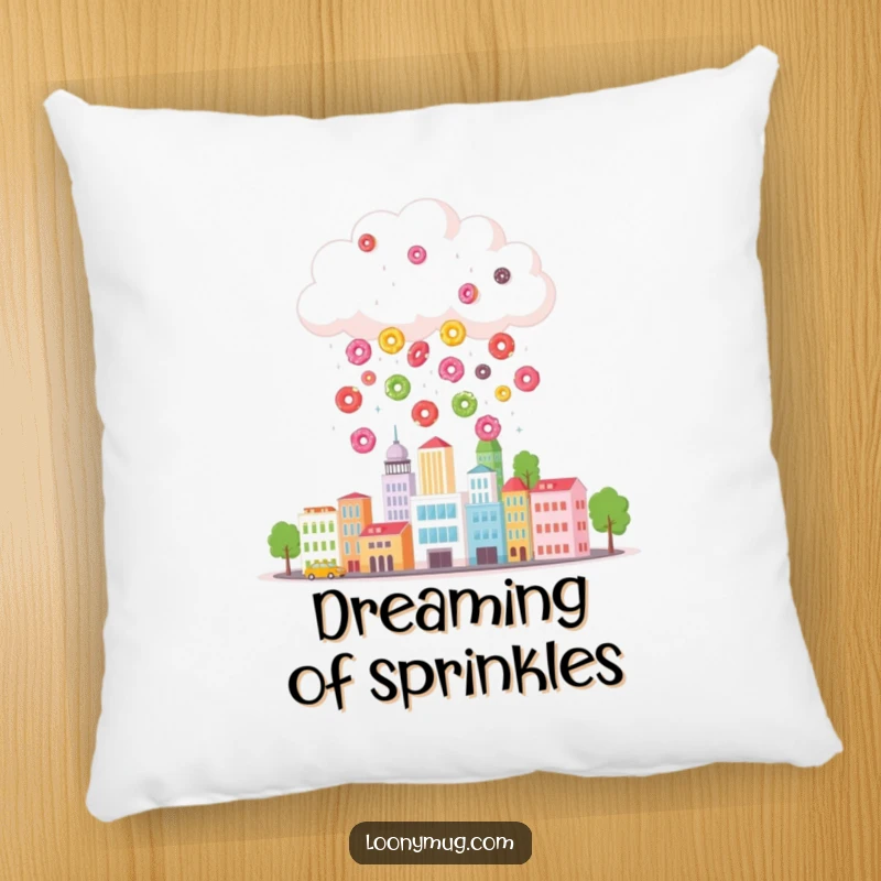 Funny pillow featuring a cloud raining colorful donuts onto a tiny cityscape, offering comfortable, whimsical, and humorous home decor.