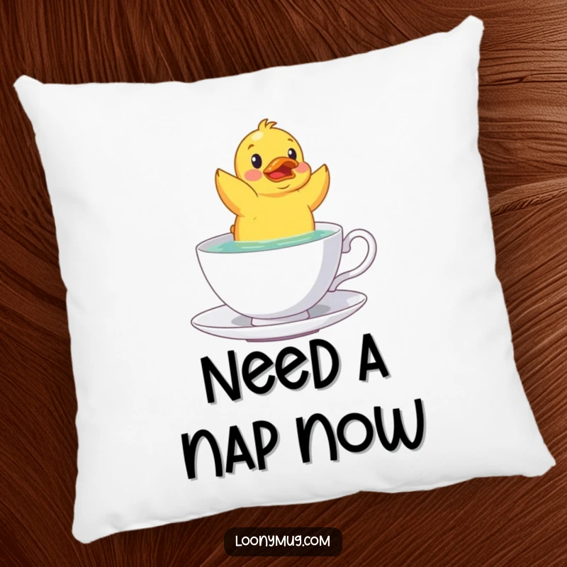 Soft pillow featuring a funny rubber duck floating upside down in a teacup, adding humor to any room.
