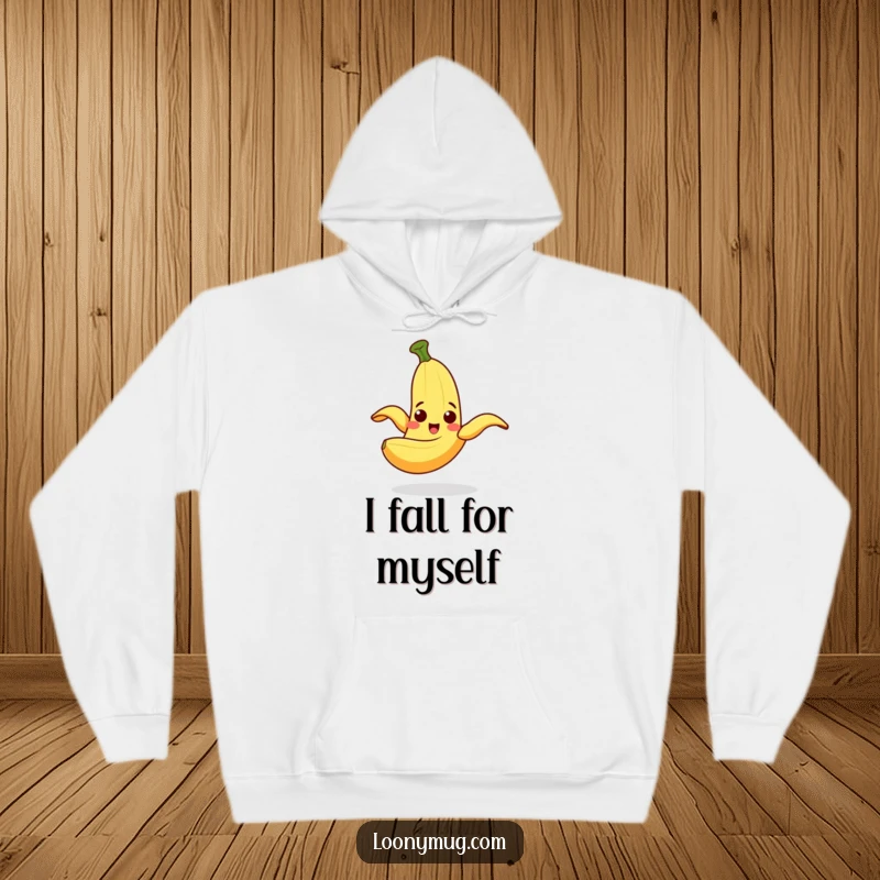 Funny Hoodie showing a cheerful banana peel slipping on itself with a surprised look, a classic comedic moment.