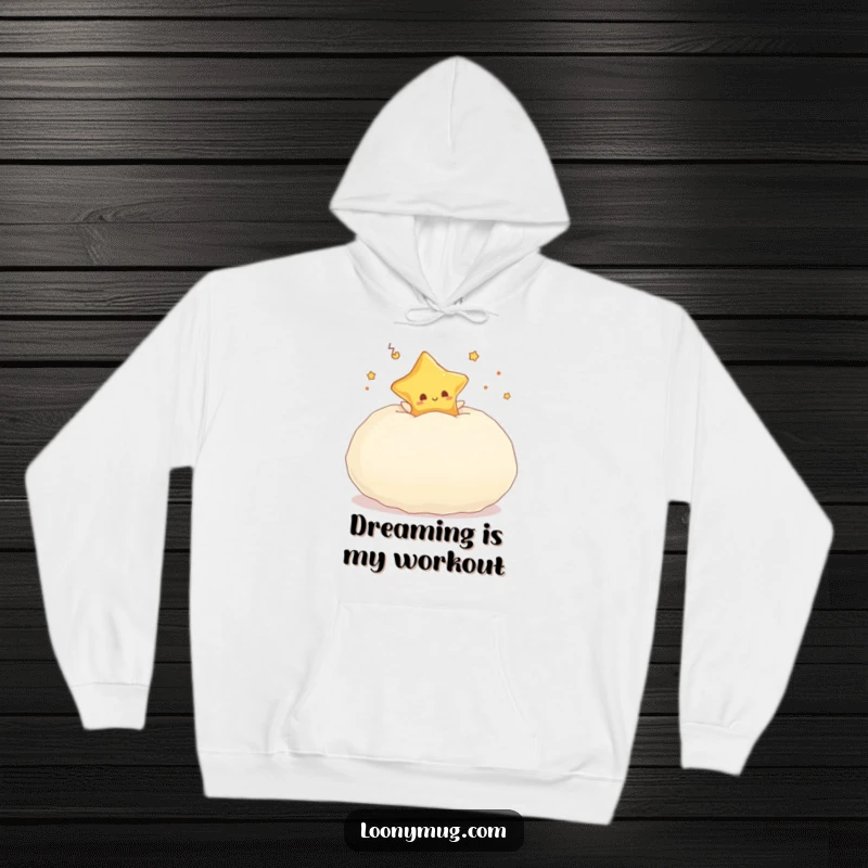 Funny hoodie featuring a dreaming star character gleefully bouncing high on a large, plush pillow.