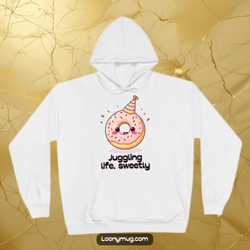 Funny hoodie depicting a cheerful donut in a party hat, enthusiastically juggling sprinkles.