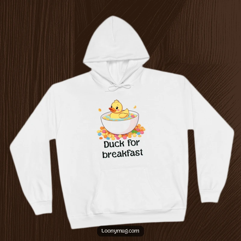 Funny rubber duck floating in a massive bowl of cereal, on a hoodie, for cozy and humorous wear, great gift.