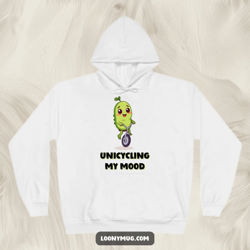 Funny hoodie depicting a mischievous pickle character riding a tiny unicycle with exceptional balance and flair.