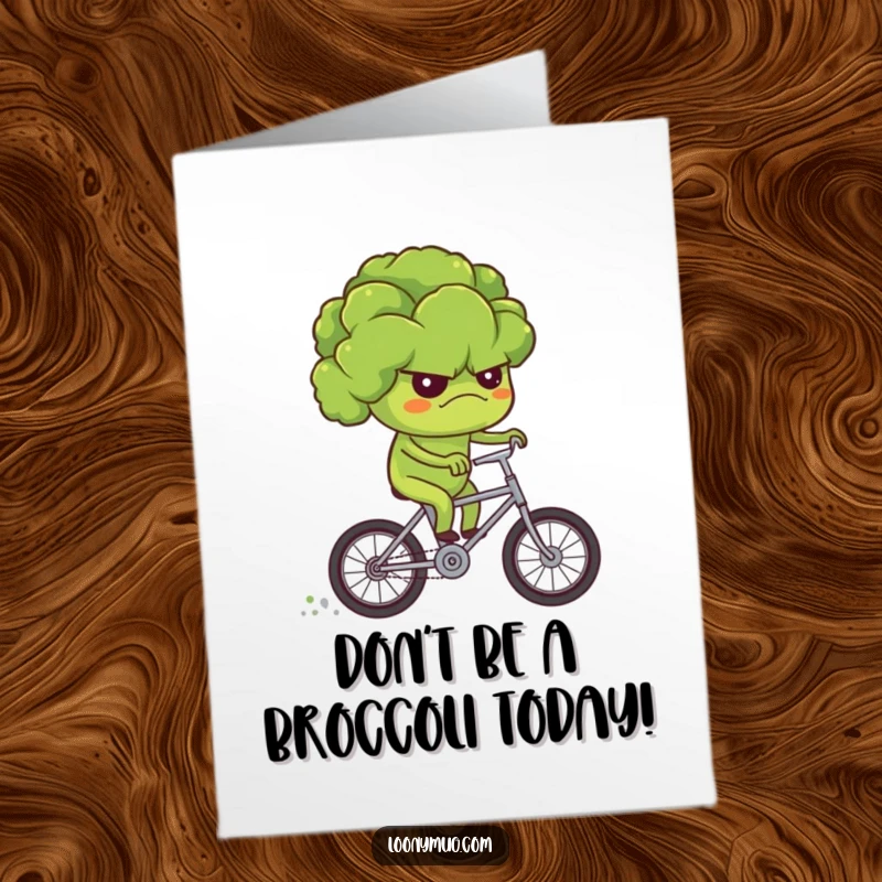 Funny free printable birthday card: a grumpy broccoli struggling to ride a tiny bicycle, looking quite displeased, for a birthday.