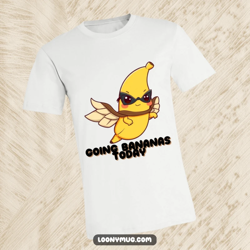 Funny t-shirt graphic of a banana in a cape flying with determination, embodying fruity heroism.