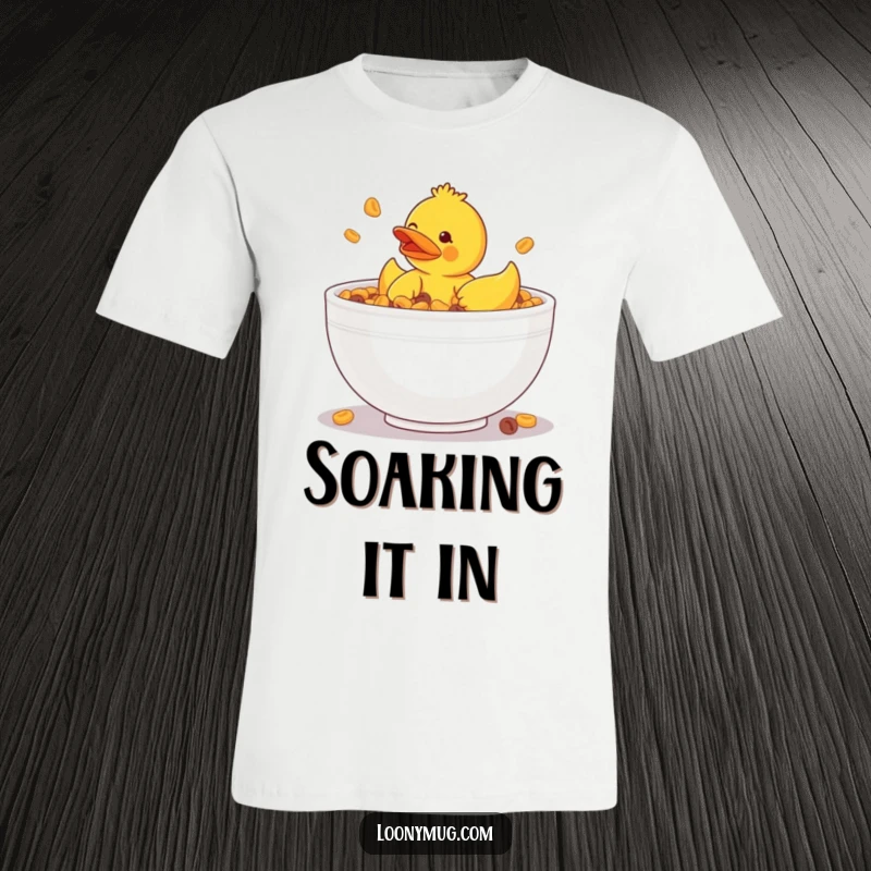 Funny t-shirt featuring a rubber ducky comically stuck in a giant bowl of cereal, highlighting breakfast silliness.