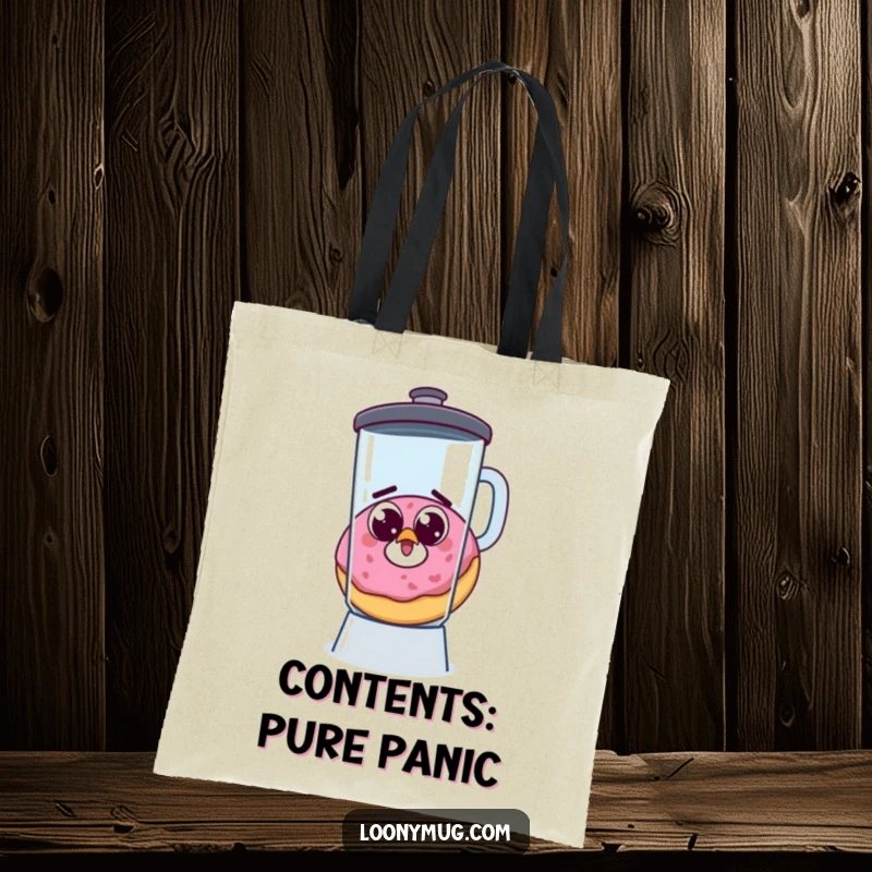 Funny tote bag with a startled donut, googly eyes wide, escaping a blender, perfect for carrying essentials humorously.
